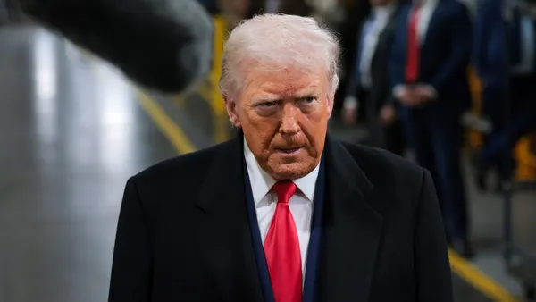 President Donald Trump tours a factory.