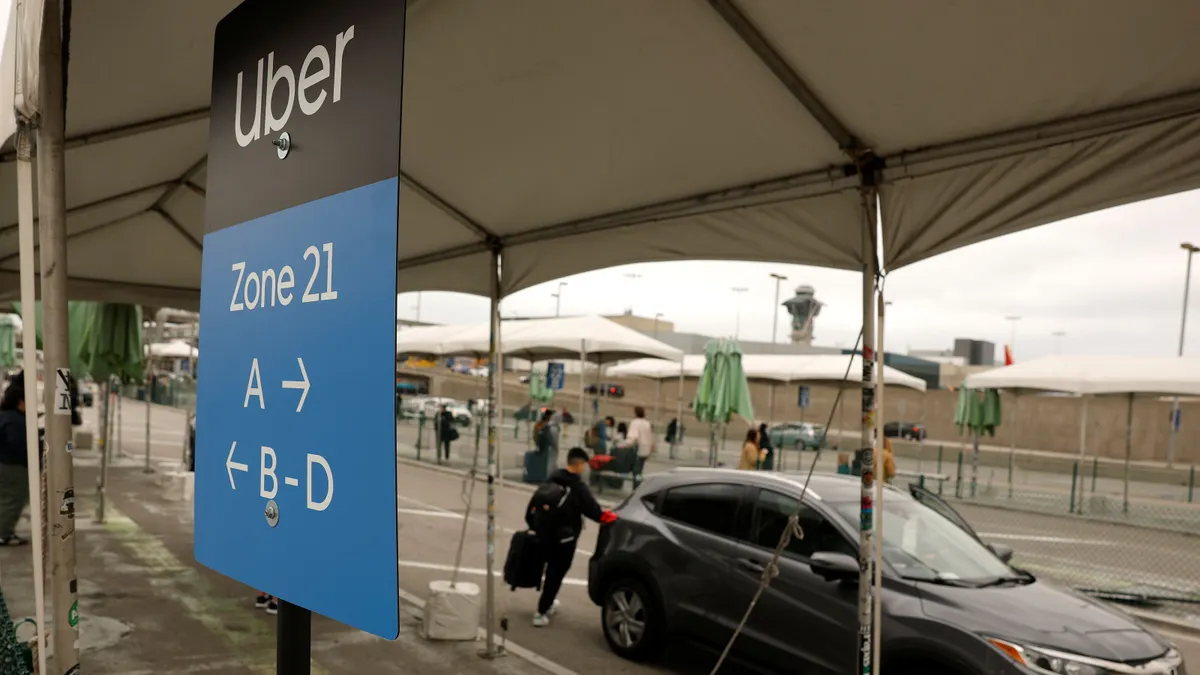 Uber customer gets into a car at Los Angeles International Airport on March 10, 2026