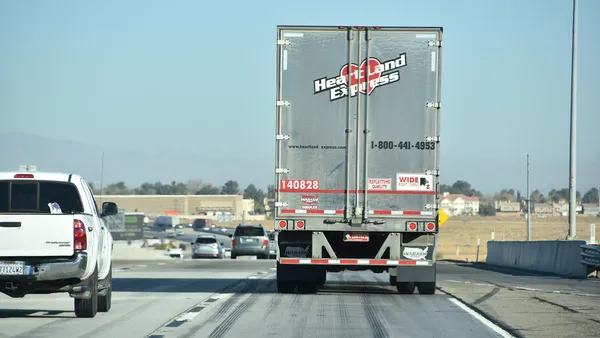 A Heartland Express truck takes a trip on the road.