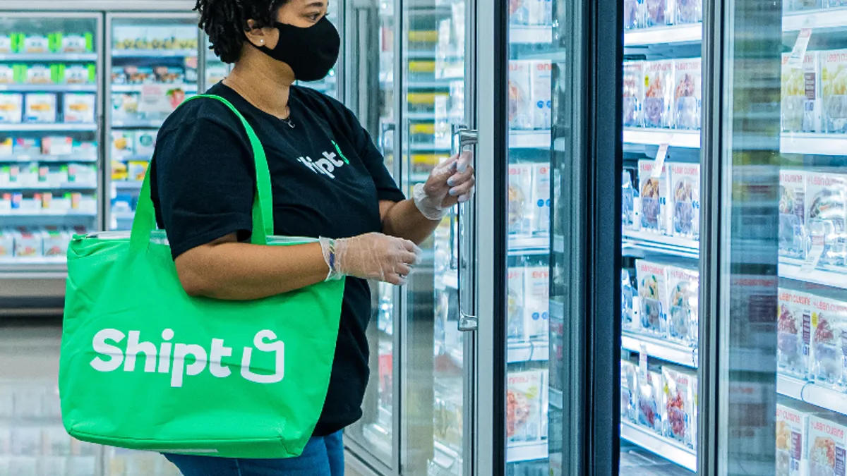 A Shipt Shopper handles a grocery order.