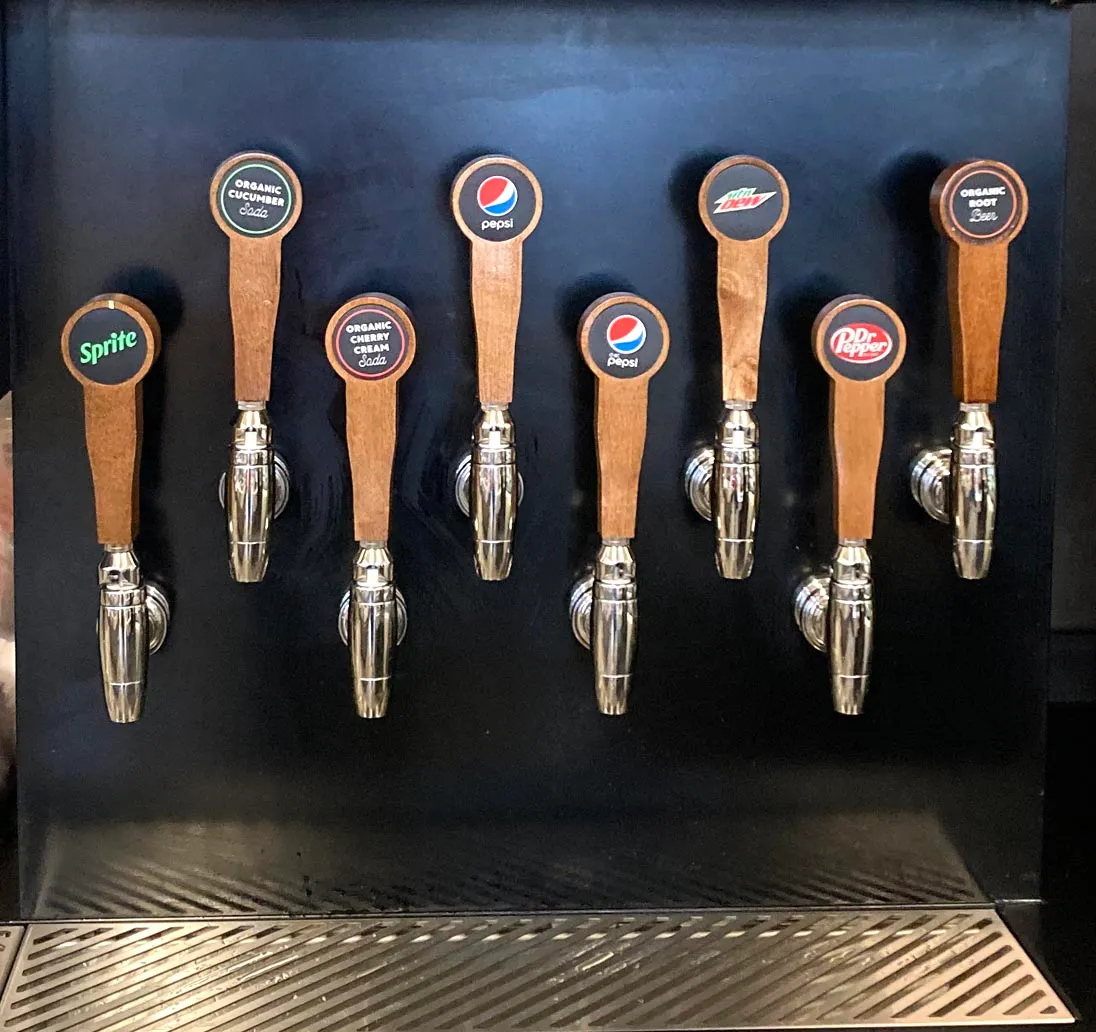 A detail photo of the soda taps at the new concept Dash In.