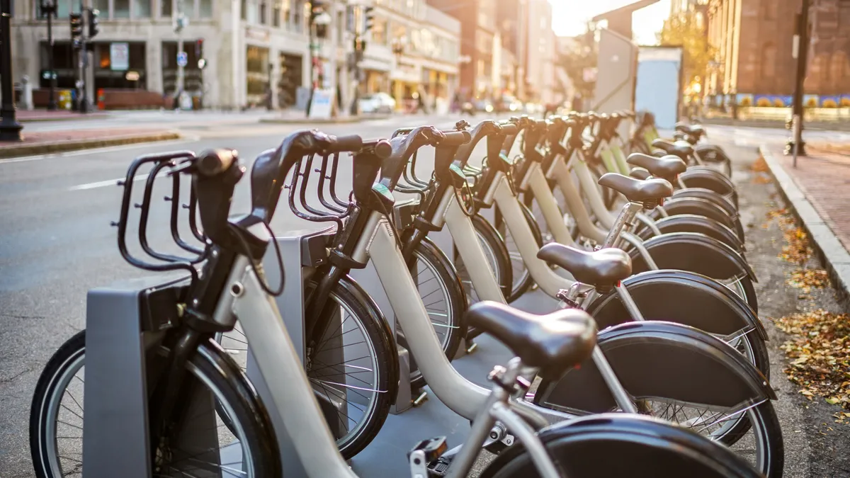 A bike-share docking station early in the morning.