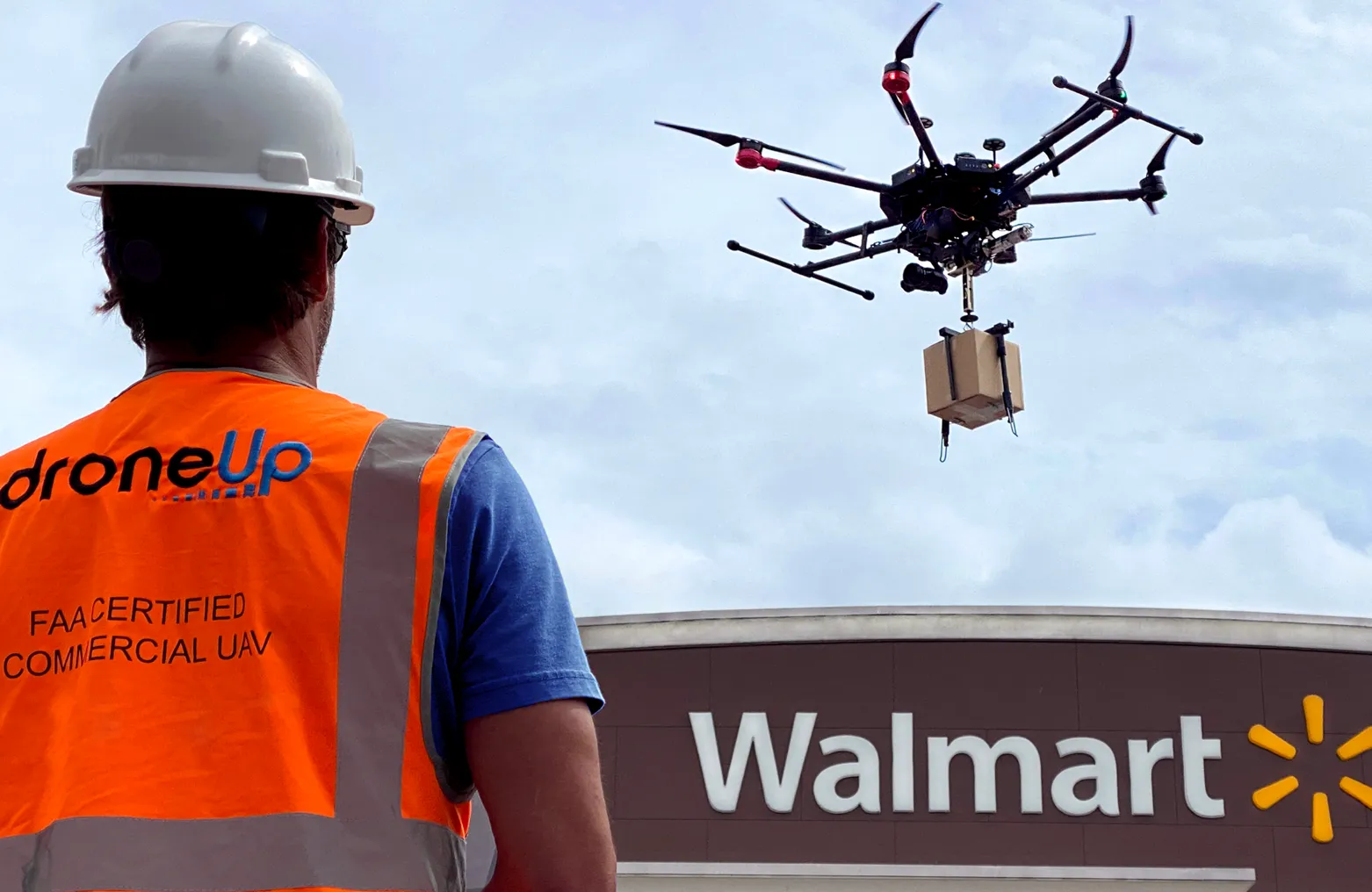 A DroneUp pilot overseeing drone delivery at Walmart store