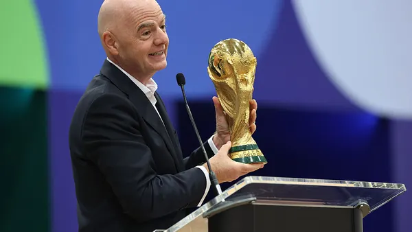 FIFA President Gianni Infantino holds the FIFA World Cup winner's trophy while speaking during the FIFA World Cup 2026 International Broadcast Center Grand Opening ceremony on June 01, 2026 in Dallas, Texas.