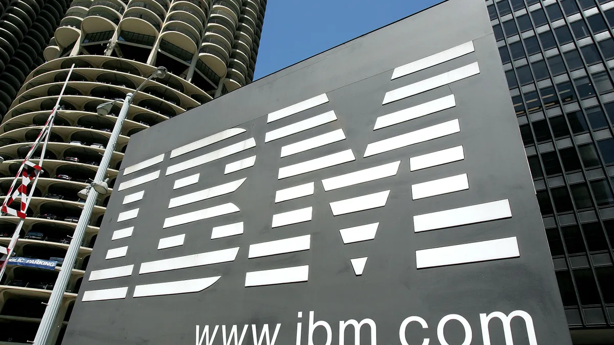 An IBM sign stands outside an IBM building in downtown Chicago, Illinois.