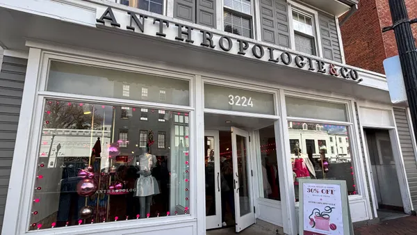 White exterior of Anthropologie storefront in Washington, D.C., with sale signs