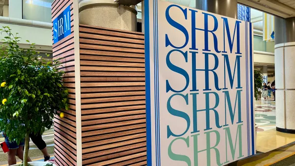 A sign that says SHRM in different colors.