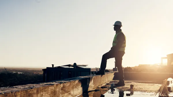 A lone construction worker on a jobsite.