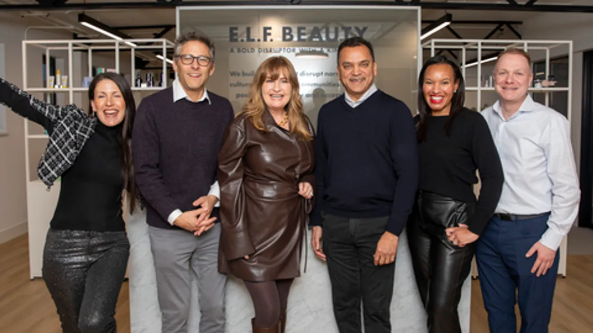 Employees at E.l.f. Beauty's London office at a grand opening event.