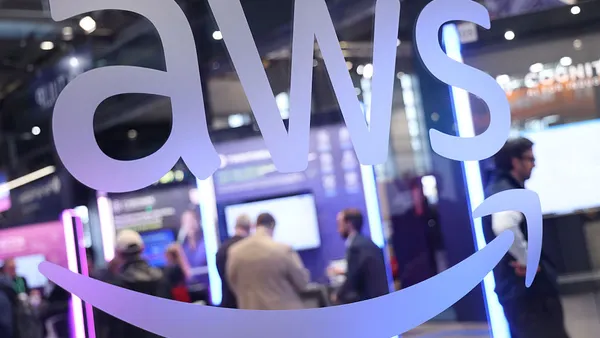 signage depicting the AWS logo at a tech conference pavillion