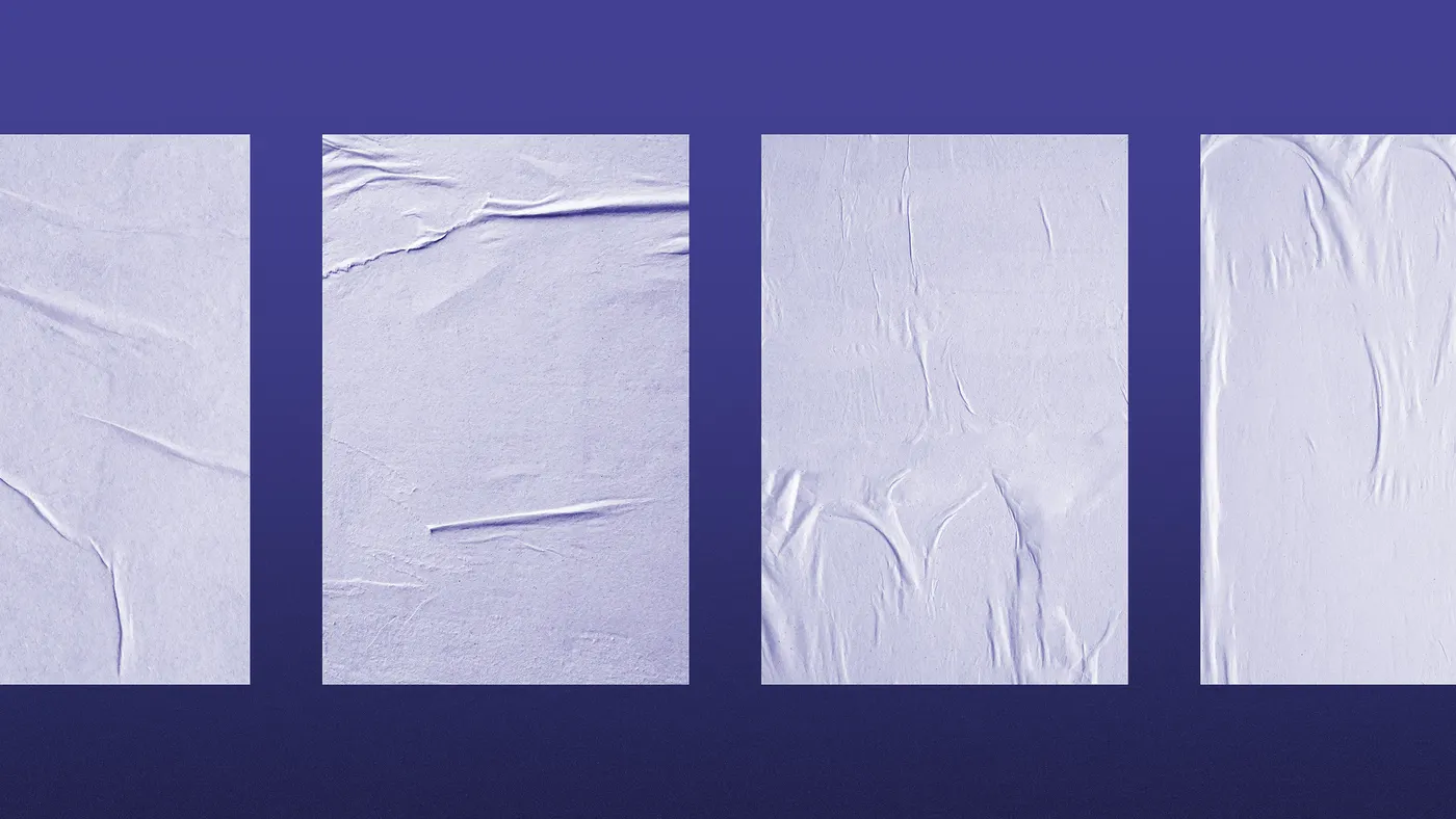 Blank paste-up posters on a wall.