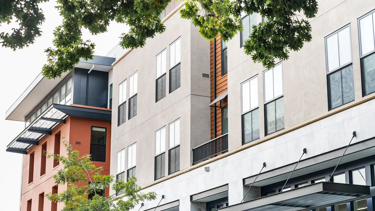 The exterior of an apartment building.