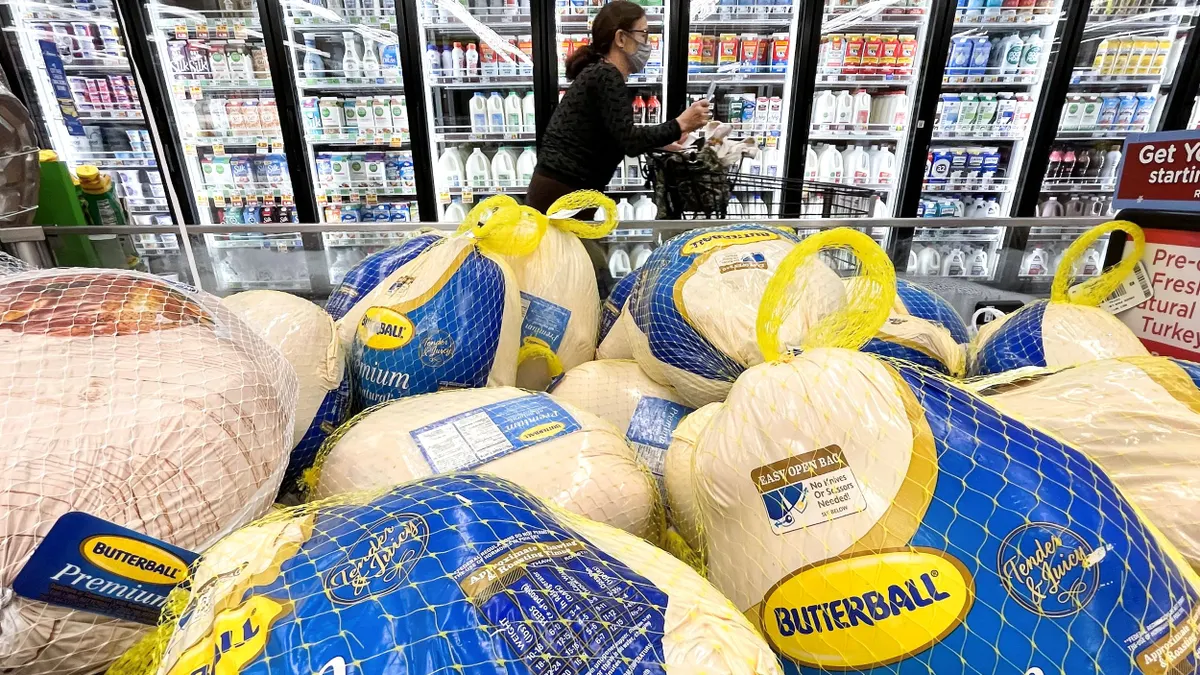 A stack of Butterball turkeys in a grocery store.