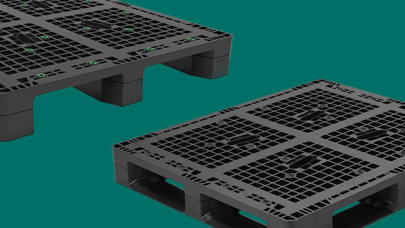 Two black plastic pallets with grid patterns are showcased against a teal background, highlighting their sturdy structure and design for efficient transport.