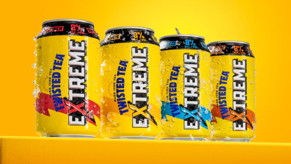 Twisted Tea Extreme cans against a yellow backdrop.