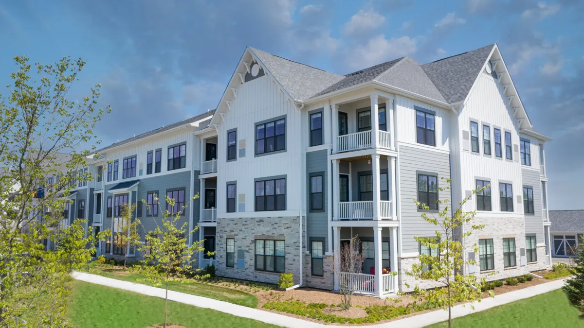 A farmhouse-style apartment building