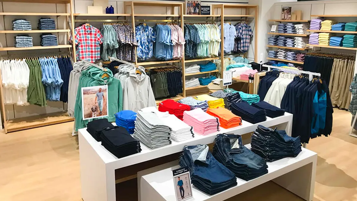 A display of clothing in the interior of an apparel store.