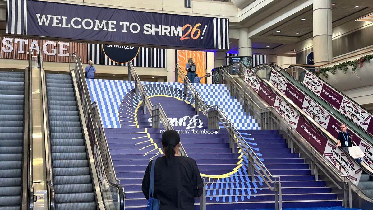 A person pauses before entering the action of SHRM 2026 in Orlando, Florida.