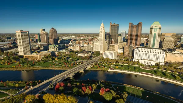 The Columbus, Ohio skyline is shown, with the river in the foreground