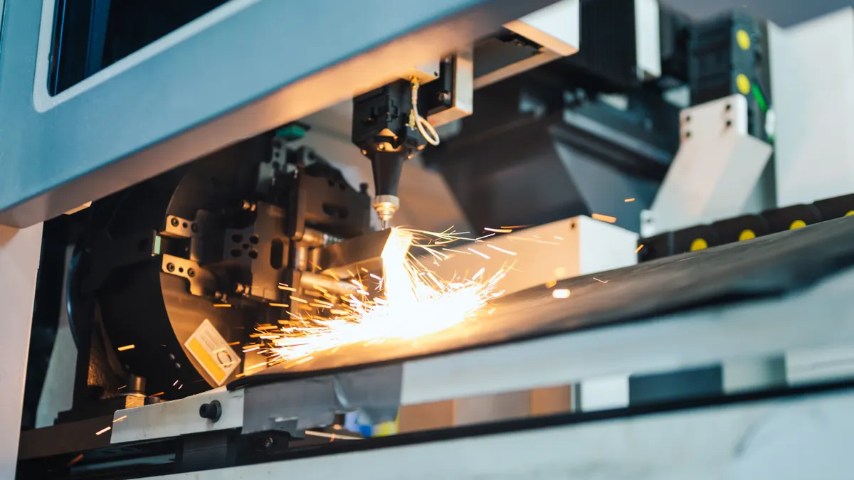 Sparks come off an industrial machine in a factory
