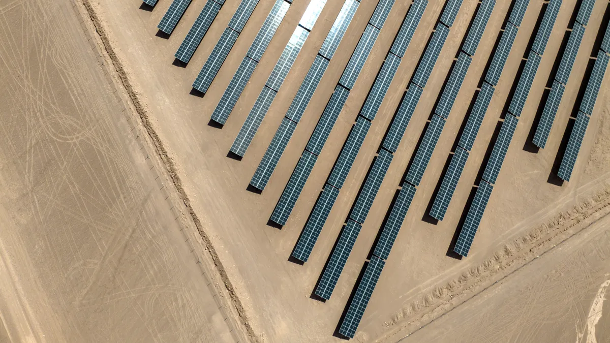 Aerial view of solar array farm in a Chilean desert.