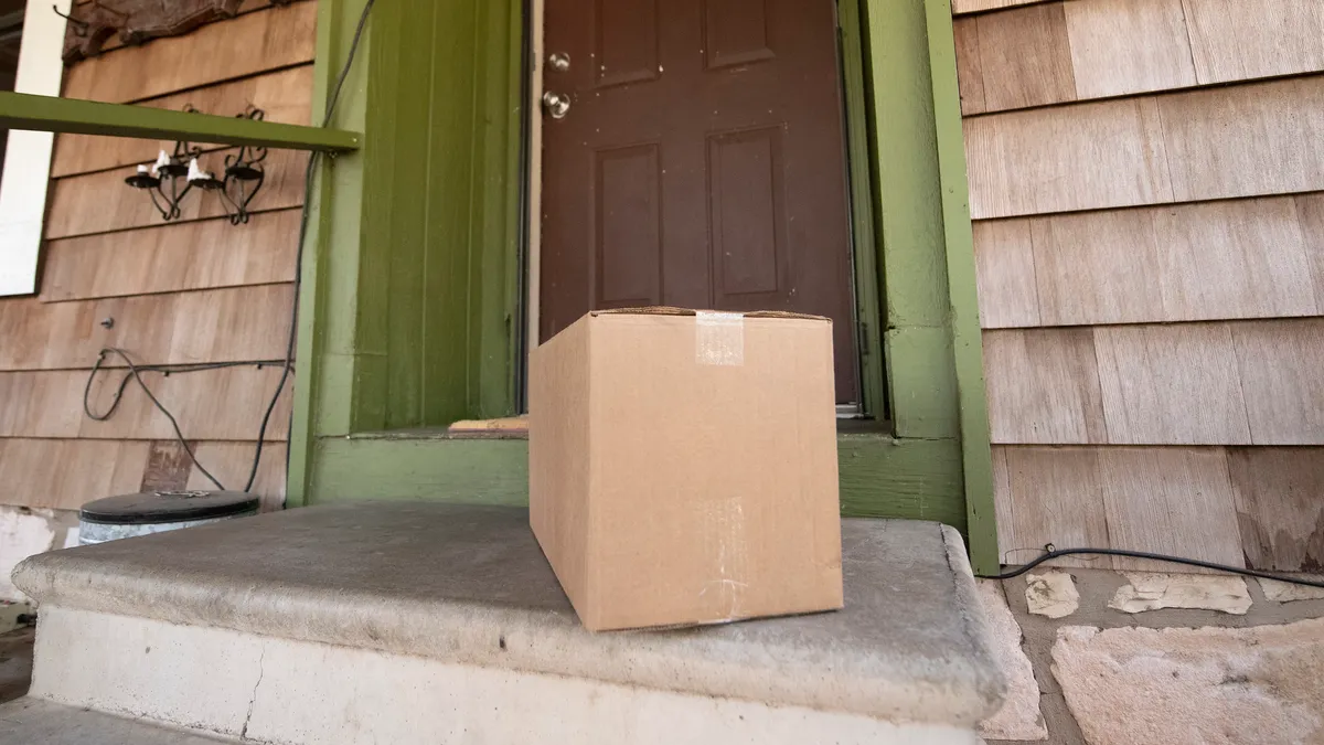 A box sits in front of a door.