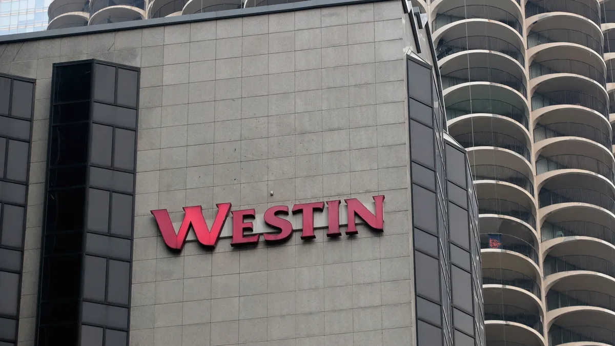 A Westin hotel logo on the outside of the building.