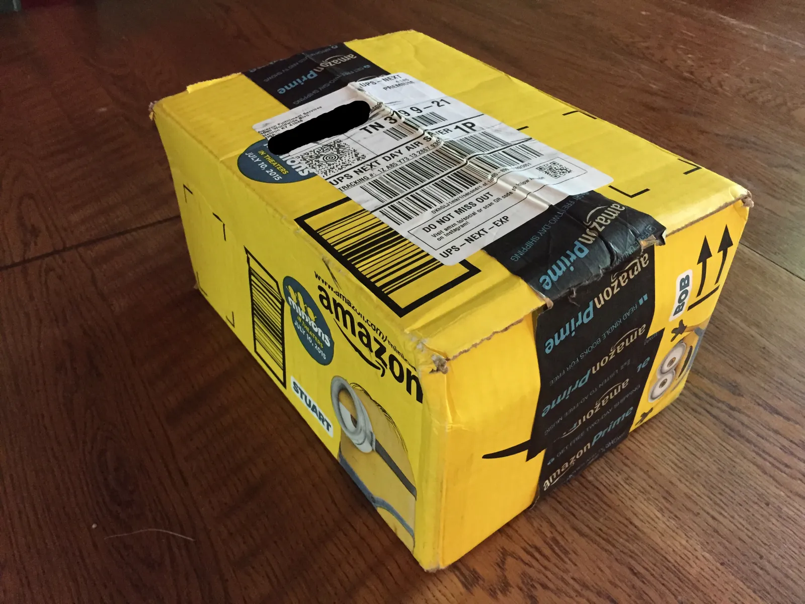 An Amazon box with a specialty image advertising a minions movie.