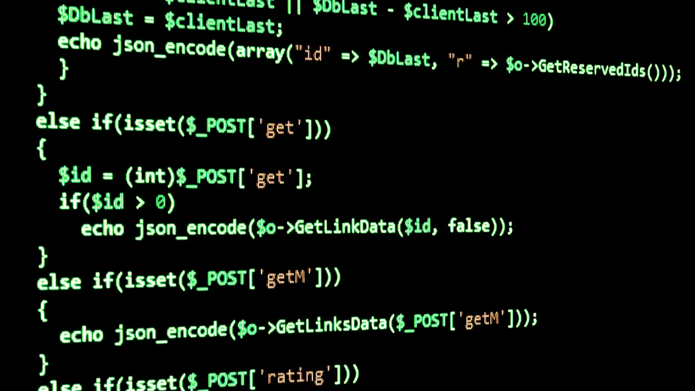 Programming code on black screen, green text