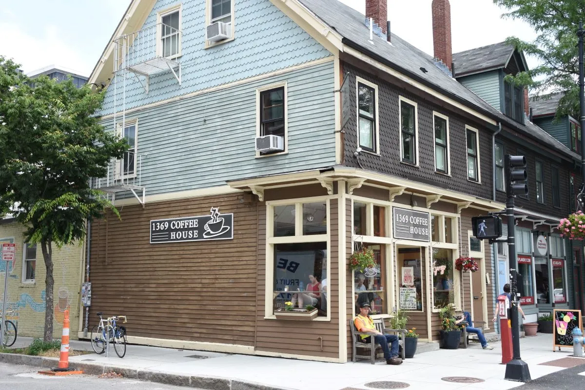 An image of a coffee house with people sitting outside in Boston