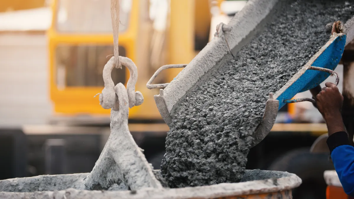 concrete flowing into a bucket