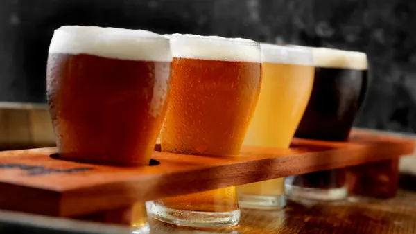 A flight of four craft beers.