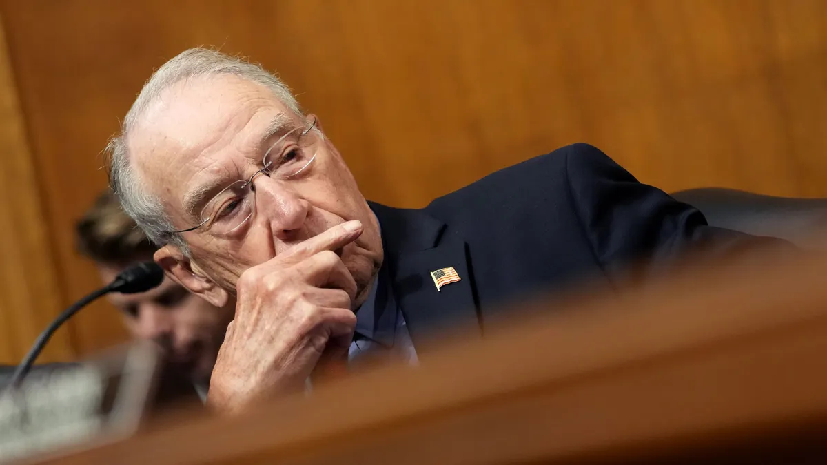 Senator Chuck Grassley is seen in a close-up at a committee hearing.