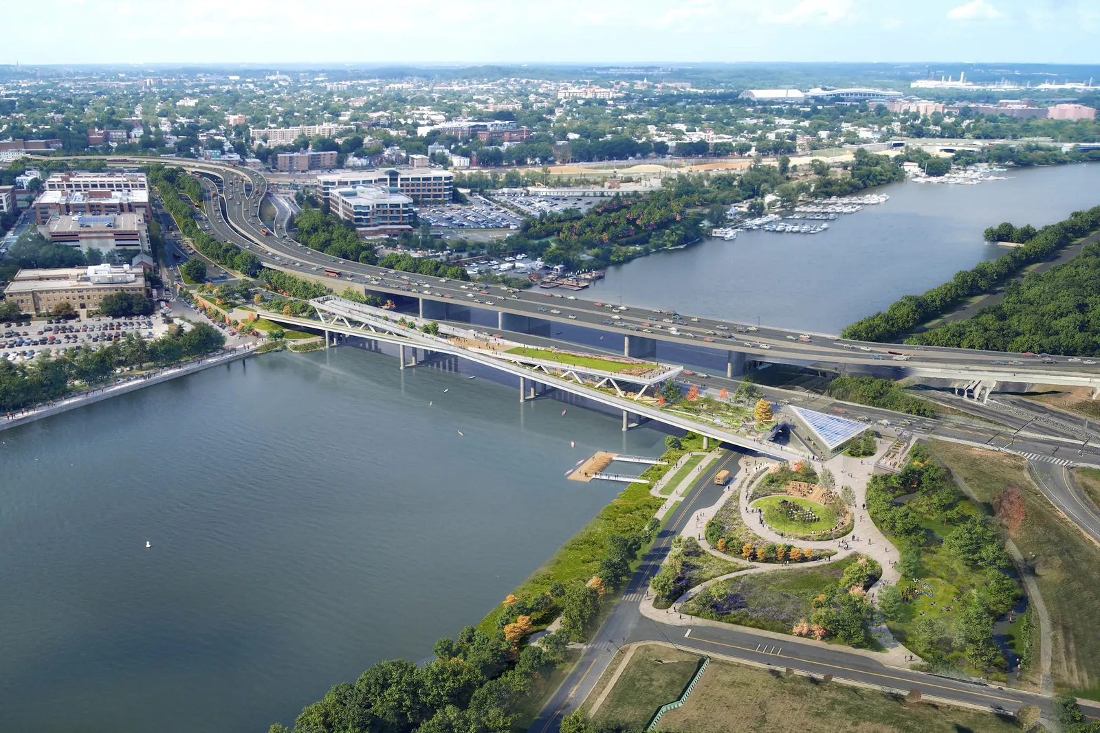 Rendering of aerial view of bridge over river with green space on the bridge and at its base.
