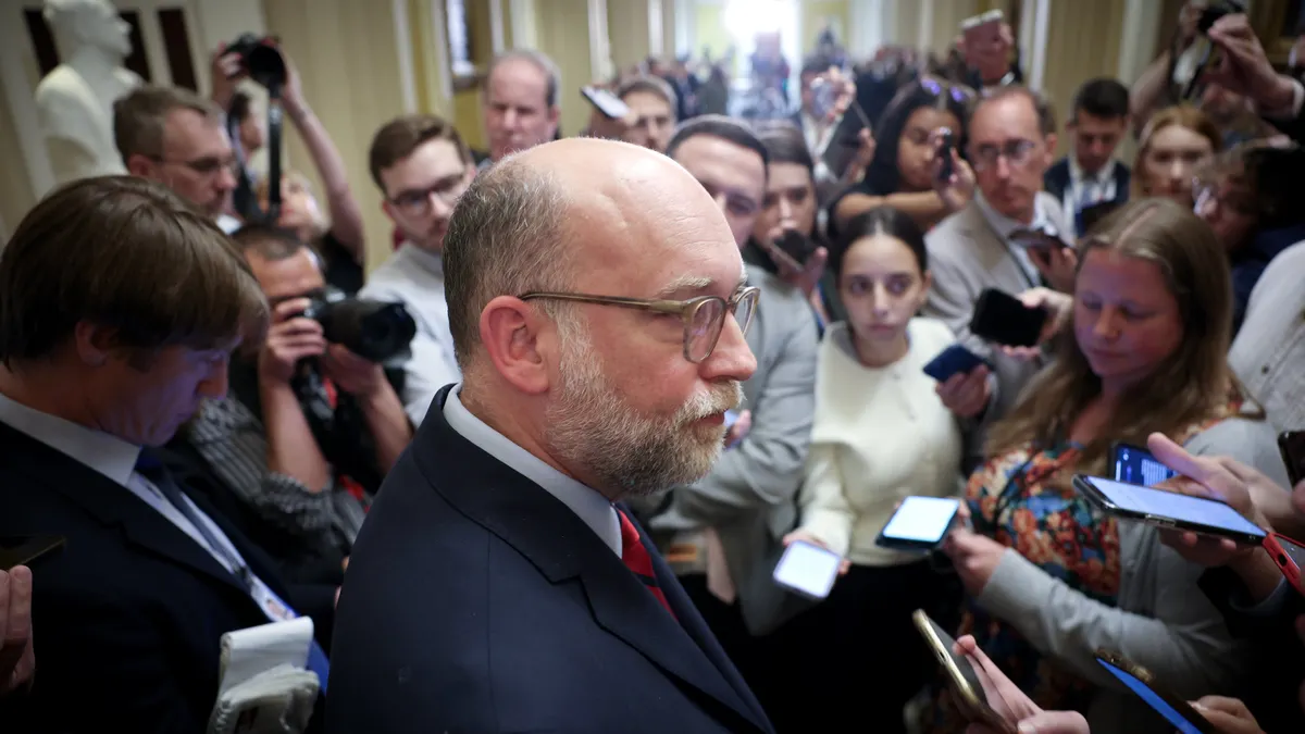 CFPB earned wage access income employees regulations Russell Vought