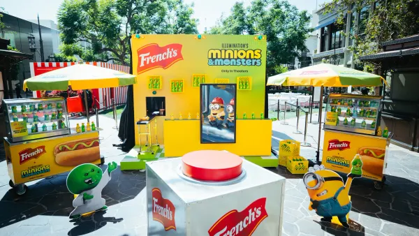 A French's pop-up in Los Angeles features a large red button and food stand