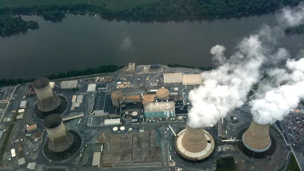 An aerial view of a nuclear power plant next to a river.