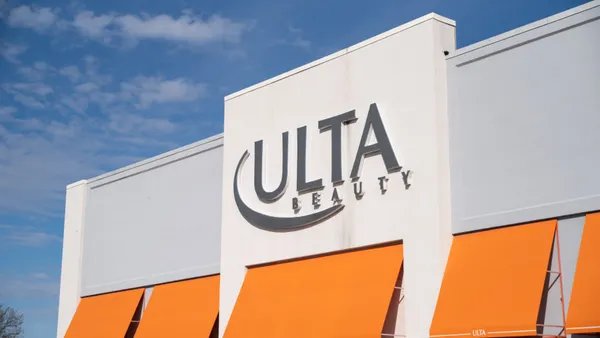 Orange and white exterior of an Ulta Beauty store.