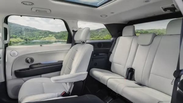 A left side interior view of a 2026 Hyundai Palisade showing the second and third-row seats.