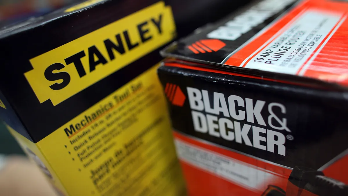 Two boxes of Stanley Black & Decker tools on a table.