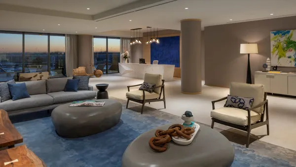 A blue and tan color scheme in an oceanfront apartment lounge