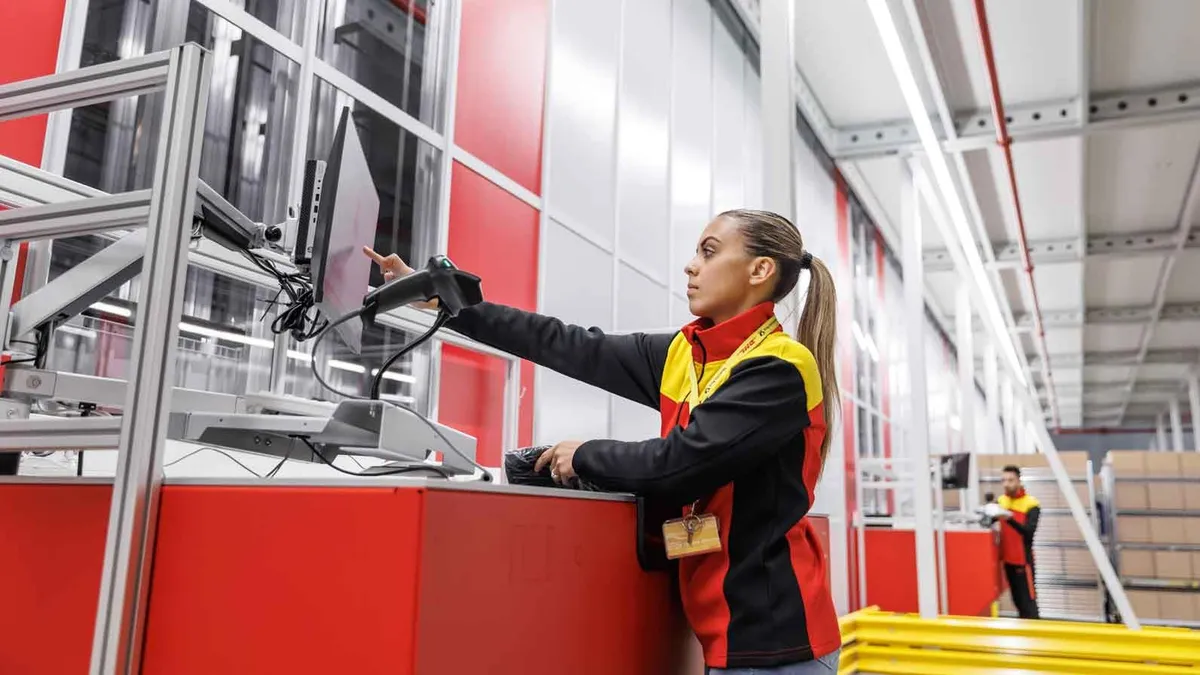 A DHL warehouse associate in Germany.