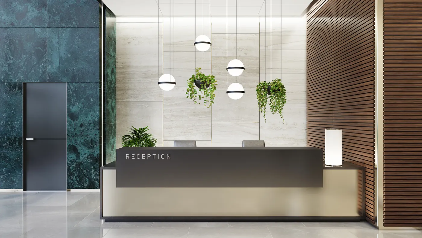 A modern and luxurious office lobby interior with elevators and stairs. The lobby features a long reception desk, green marble tiles on the walls.