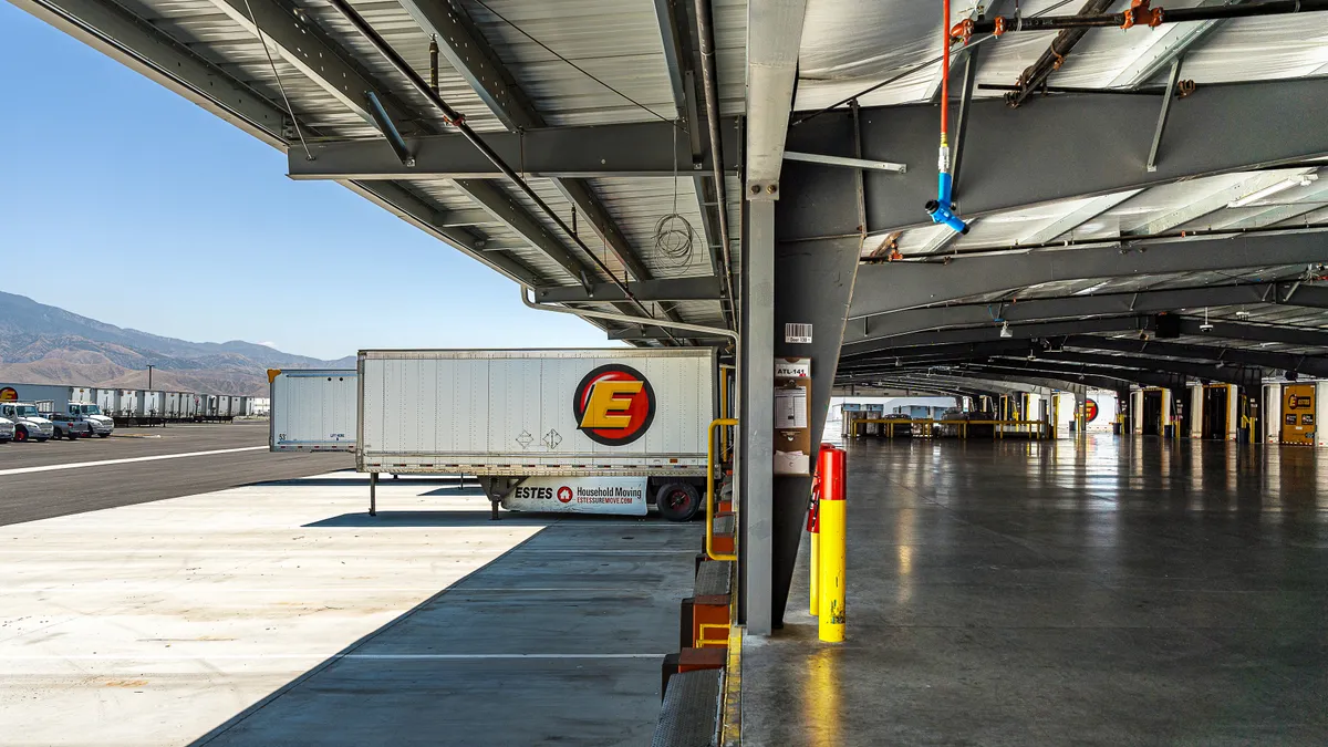 A photo shows the interior and exterior of Estes Express Lines' new LTL terminal in Banning, California.