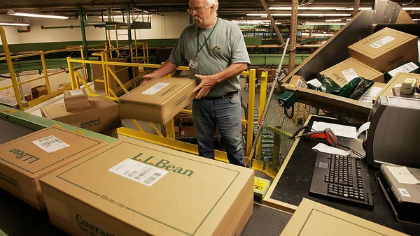 A worker sorts boxed orders in the L.L. Bean shipping center on Nov. 28, 2005 in Freeport, Maine.