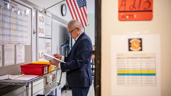 Houston Independent School District Superintendent Mike Miles examines a document during a visit to Navarro Middle School.