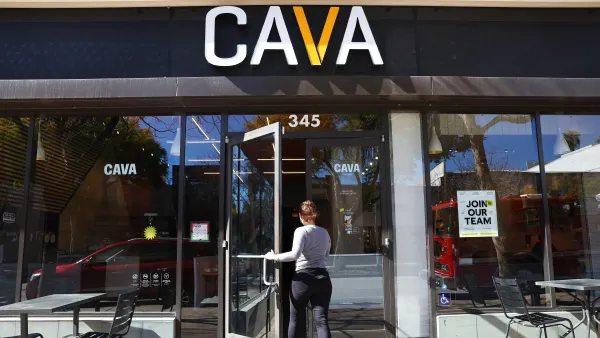 An image of a customer entering a Cava restaurant.