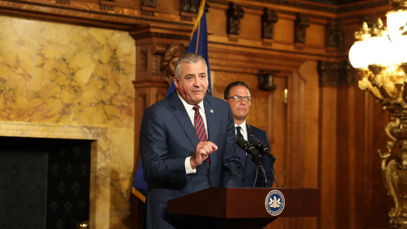 A man stands at a podium.