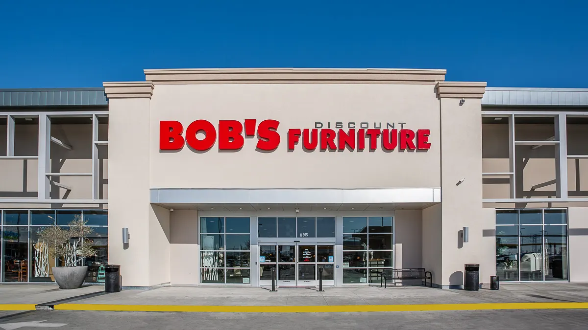 Beige storefront with red lettering saying Bob's Discount Furniture
