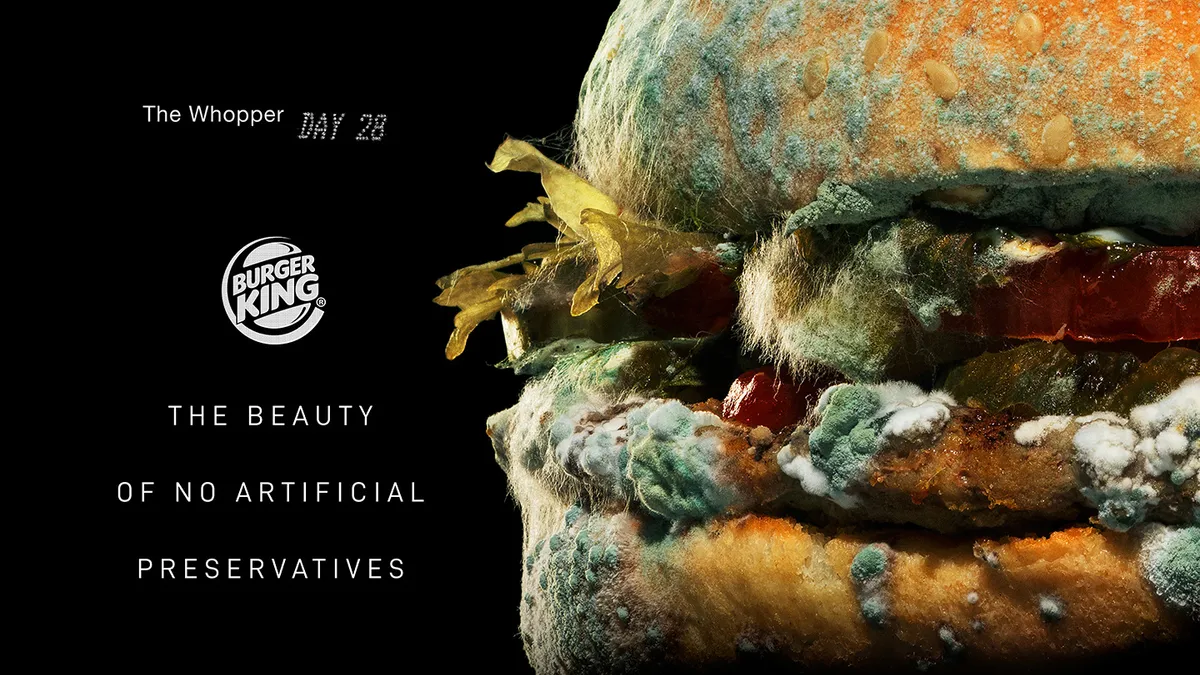 A promotional still of the Moldy Whopper, part of a Burger King campaign marketing the removal of artificial preservatives from menu items